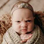 A Newborn Girl Mean Mugs During a Photoshoot, and Her Pics Might Be the Best Thing You’ll See Today_5e0cb9d60a30f.jpeg